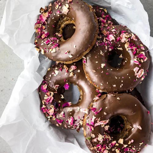 Vegan, gluten-free Almond Butter Donuts drizzled with almond butter chocolate glaze
