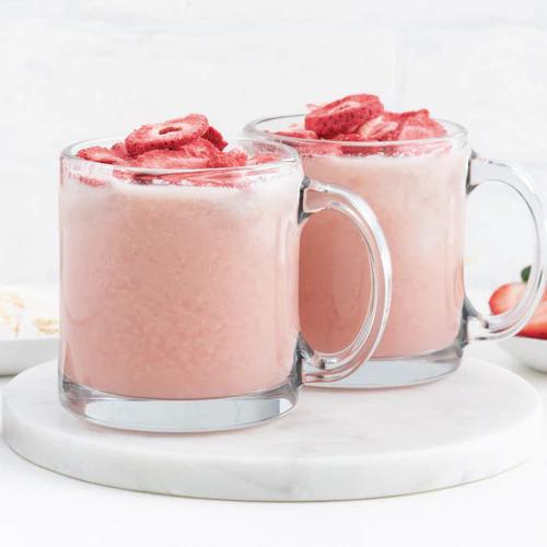 Refreshing Almond Cow Pink Drink decorated with ripe strawberry slices