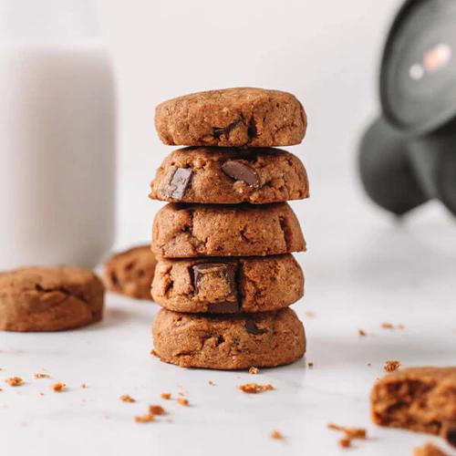 Stacked pumpkin cookies made with Almond Cow's walnut pulp and chocolate chips