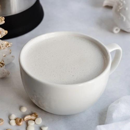 Creamy, decadent Hot White Chocolate beverage prepared with Almond Cow