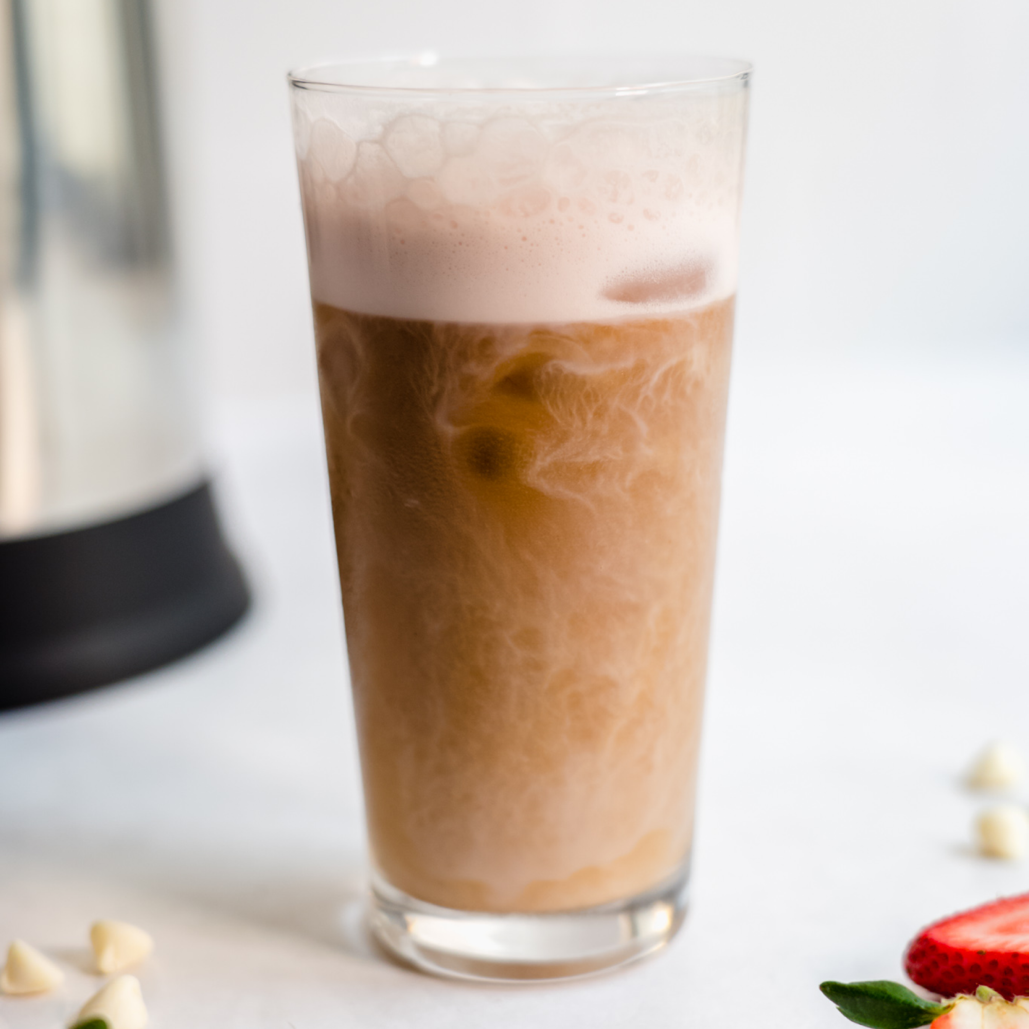Delicious and refreshing Iced White Chocolate Strawberry Latte made using Almond Cow's almond milk machine