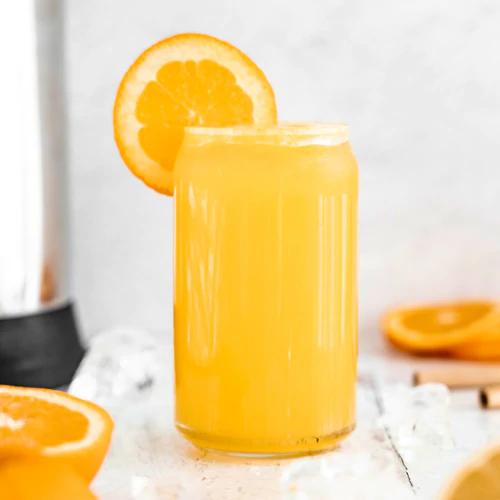 Cold, refreshing glass of Orange Lemonade prepared by Almond Cow machine