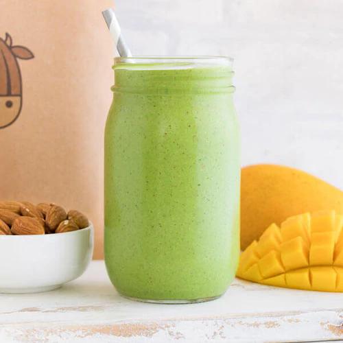 Nutritious Green Smoothie made with Almond Cow milk and pulp cubes