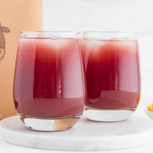 'Delicious Pomegranate Punch made effortlessly with Almond Cow'
