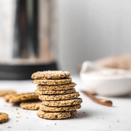 Nutritious Gluten-Free Seed Crackers made using Almond Cow's Cashew Milk sitting on a kitchen counter