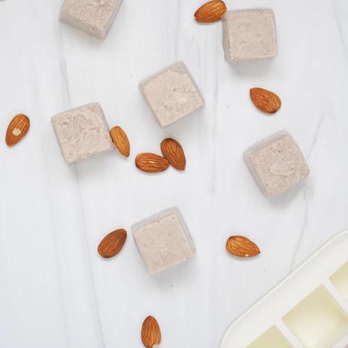 Close-up image of Almond Cow's frozen pulp cubes, a creative leftover pulp solution