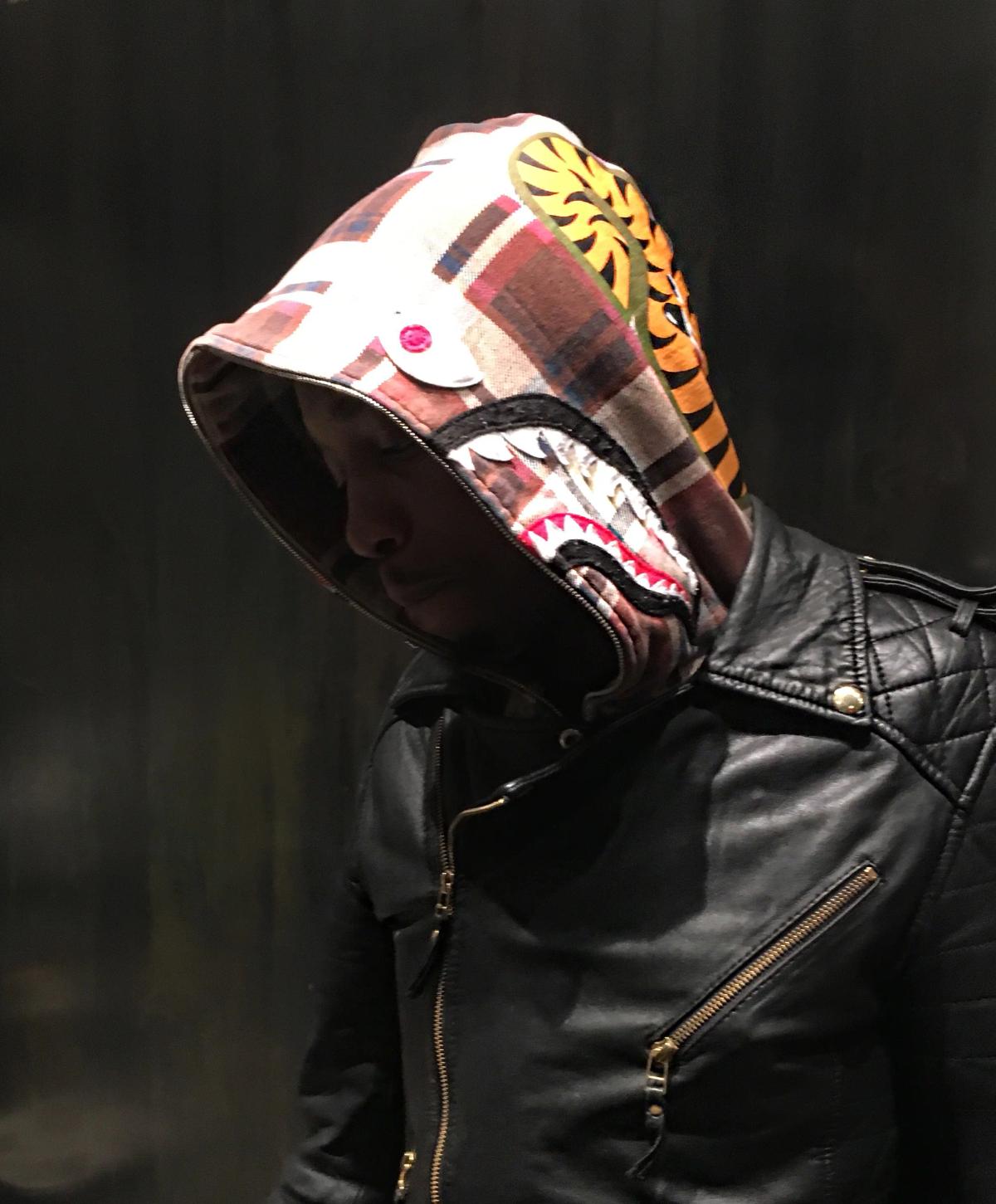 Man in black jacket with hood on