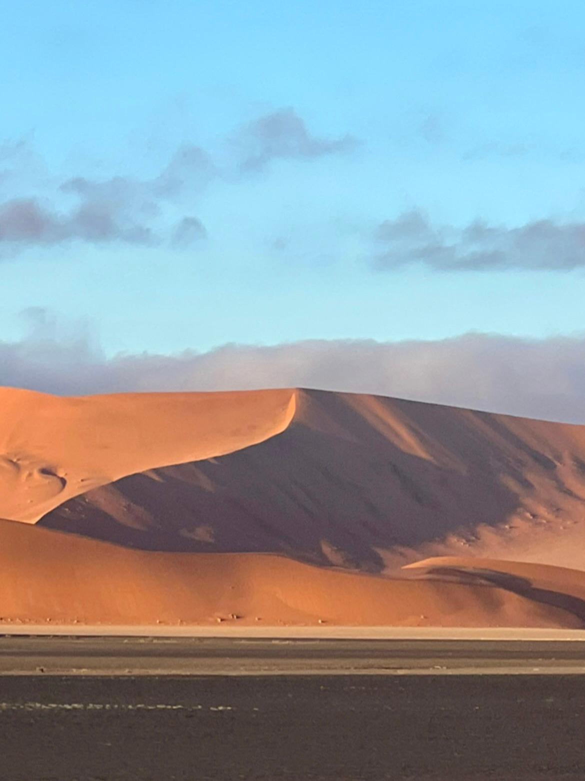 shadows in the orange sand in Namibia desert
