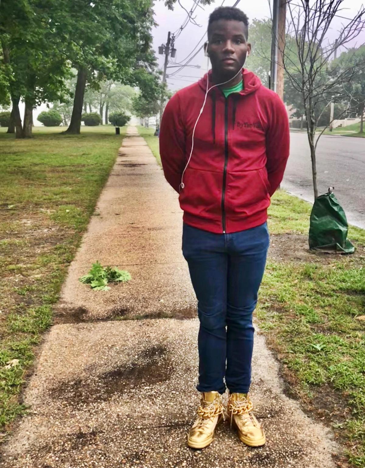 Man standing on sidewalk