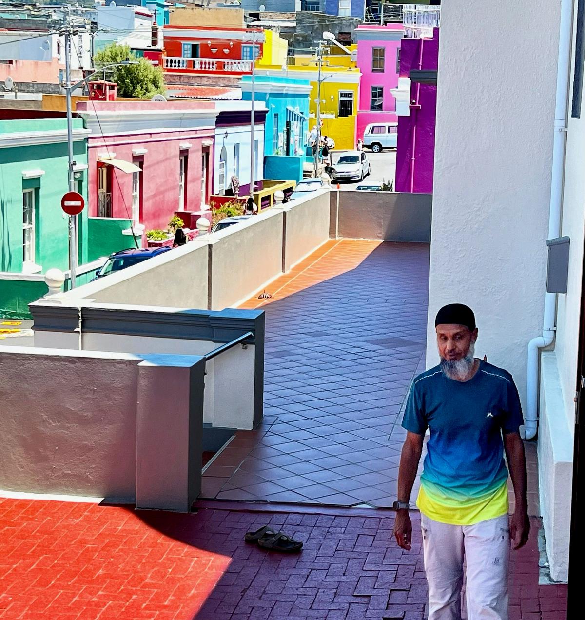 Man walking with backdrop of buildings