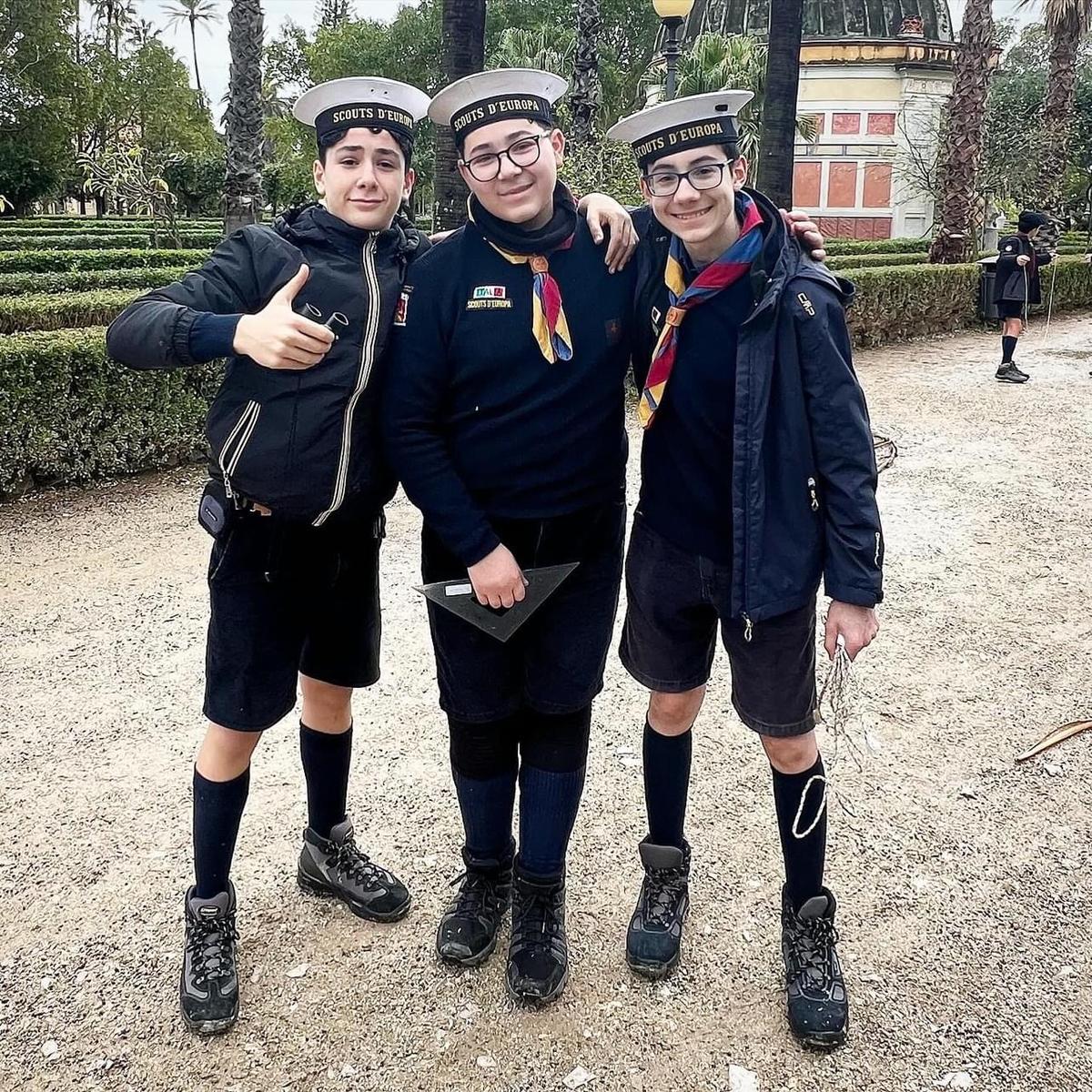 3 Boy Scount buddies in a Palermo park in dark uniforms
