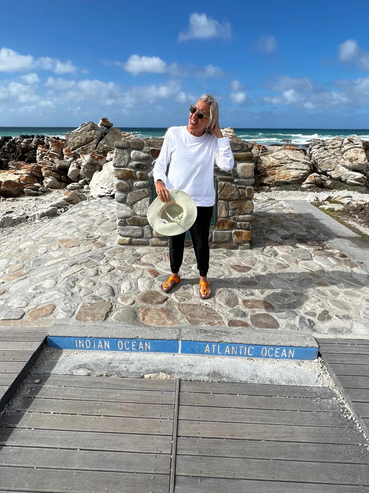 Woman standing on ocean line border