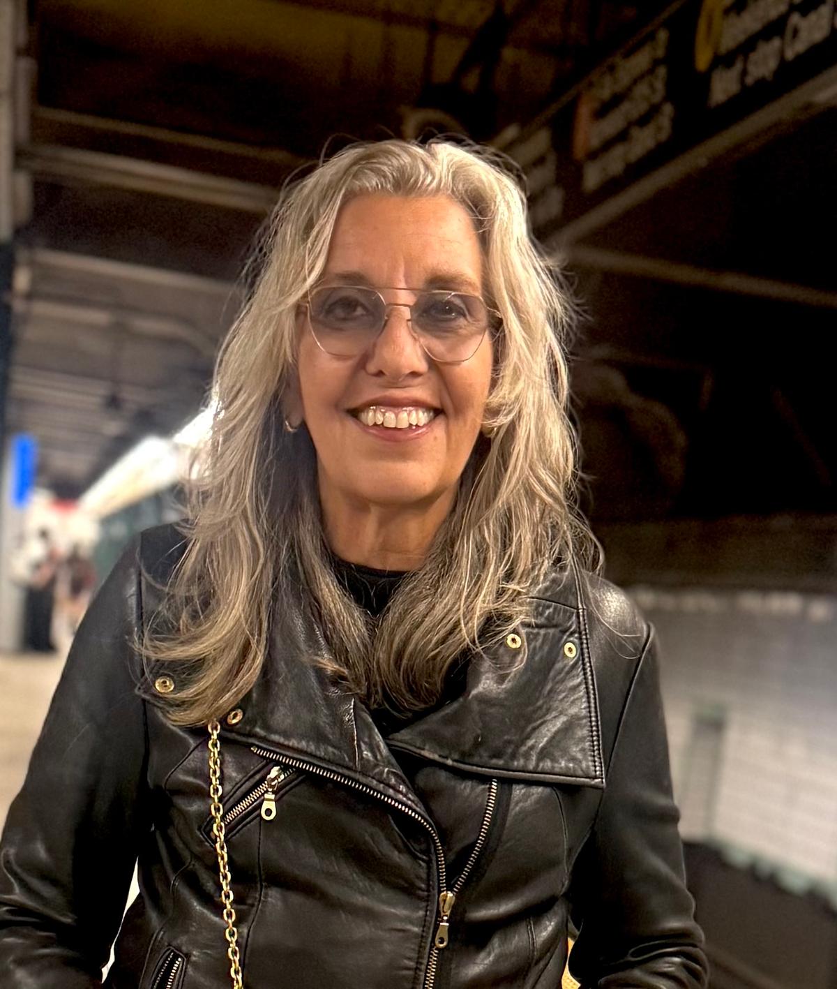 Woman smiling on subway platform