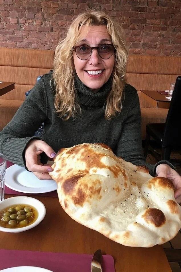 Woman smiling with bread