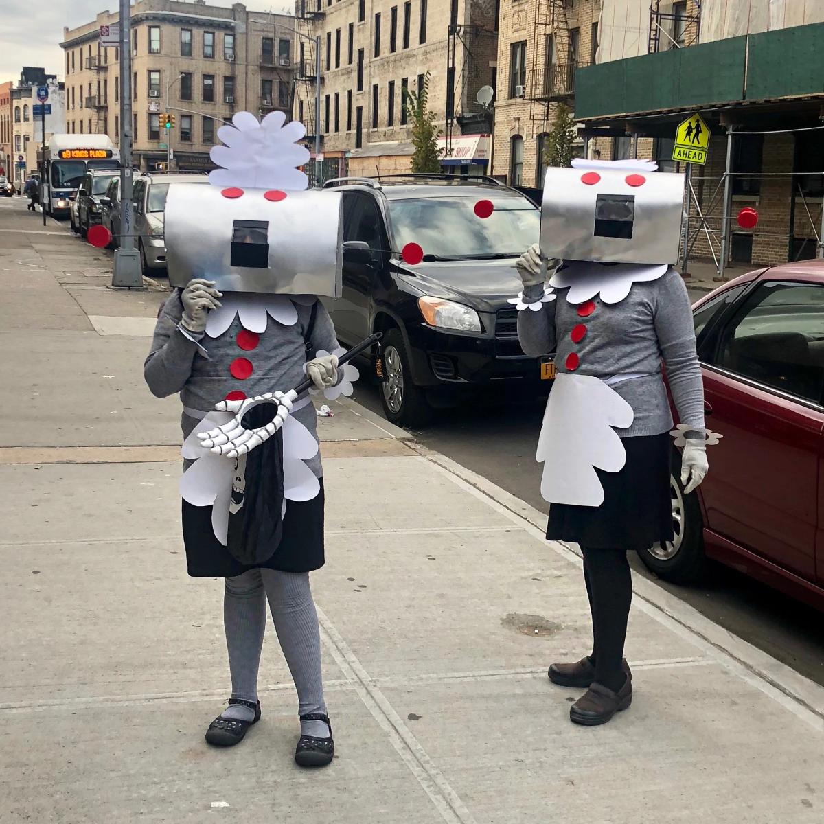 Two people in robot maid costumes