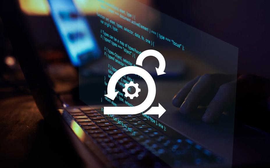 Laptop displaying code on screen overlaid with a white icon of arrows and gear.