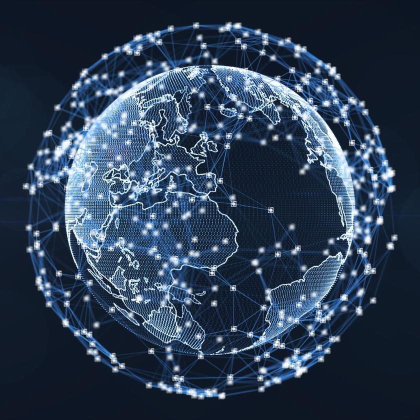 Ein blau leuchtender digitaler Globus, umgeben von einem Netz aus Punkten und Linien