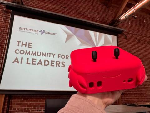 Red smiling device in front of the summit stage