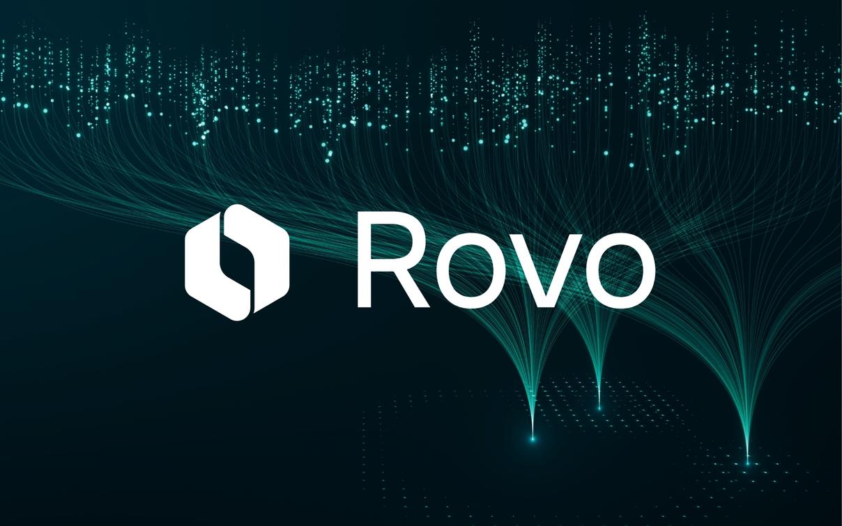 Großes Rovo-Logo von Atlassian auf dunkelblauem Hintergrund mit digitalen Partikeleffekten und Lichtstrahlen.