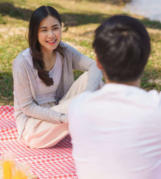 Couple having a picnic date in a park