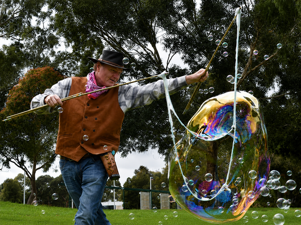 Billy the Kidding Bubble Wrangler creating giant bubbles for families at Big Croc Weekend