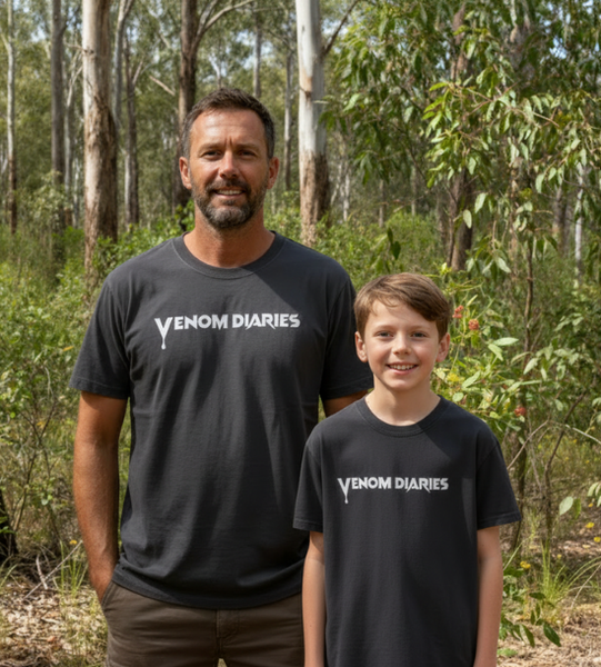 Man and child in matching venom diaries tshirts