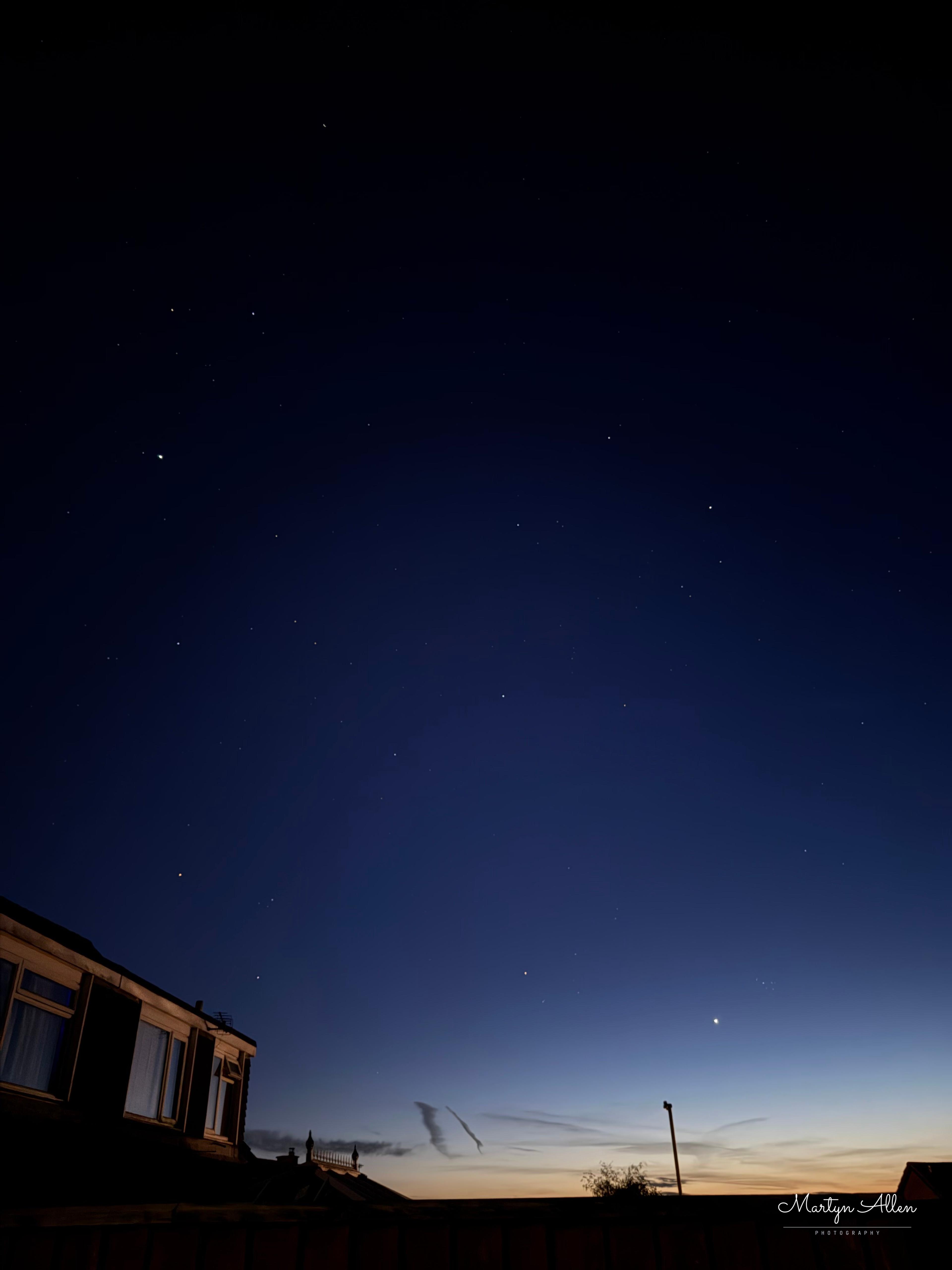 Venus low over the rooftops at dusk — checked against its real computed position for this exact time and place, not just assumed from the sky's brightest point.