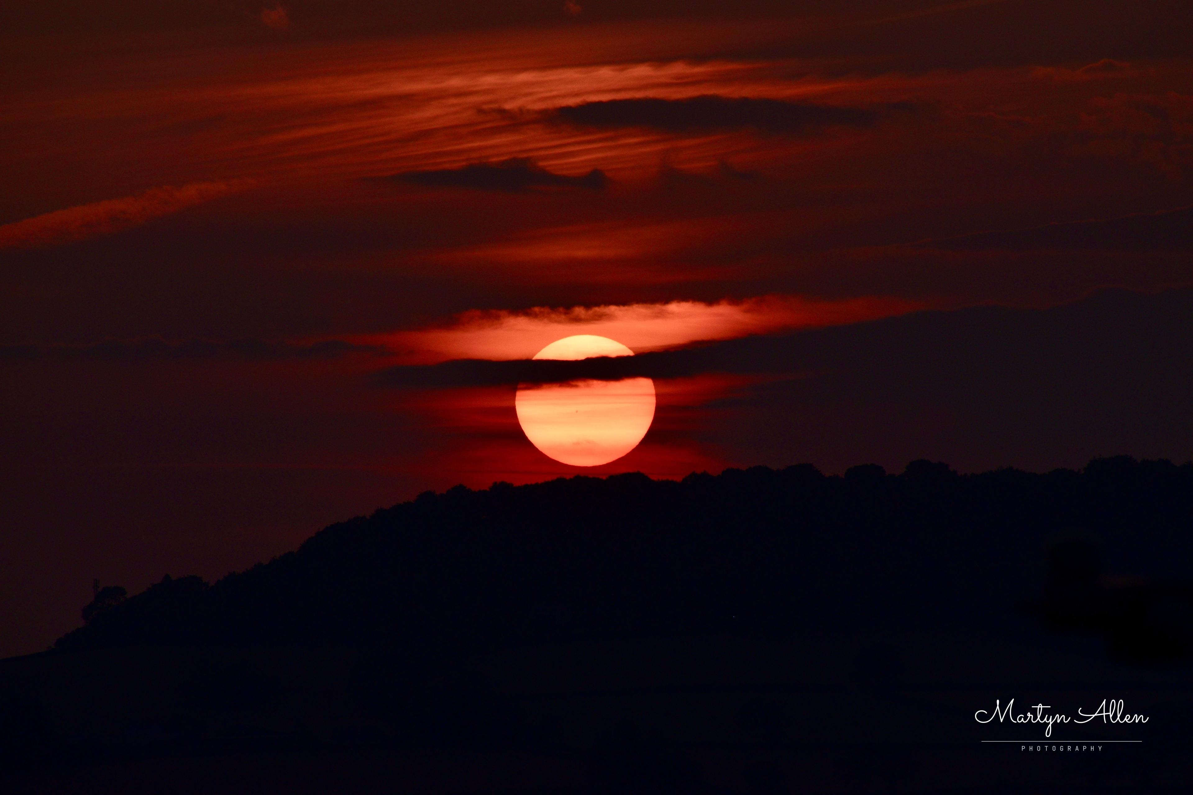 Golden hour over the hills near Combe Raleigh, East Devon. Out of all the frames I shot as the sun went down (varying ISO, aperture and shutter speed), this one is my favourite—if you zoom in closely, you can actually spot a solar sunspot! 