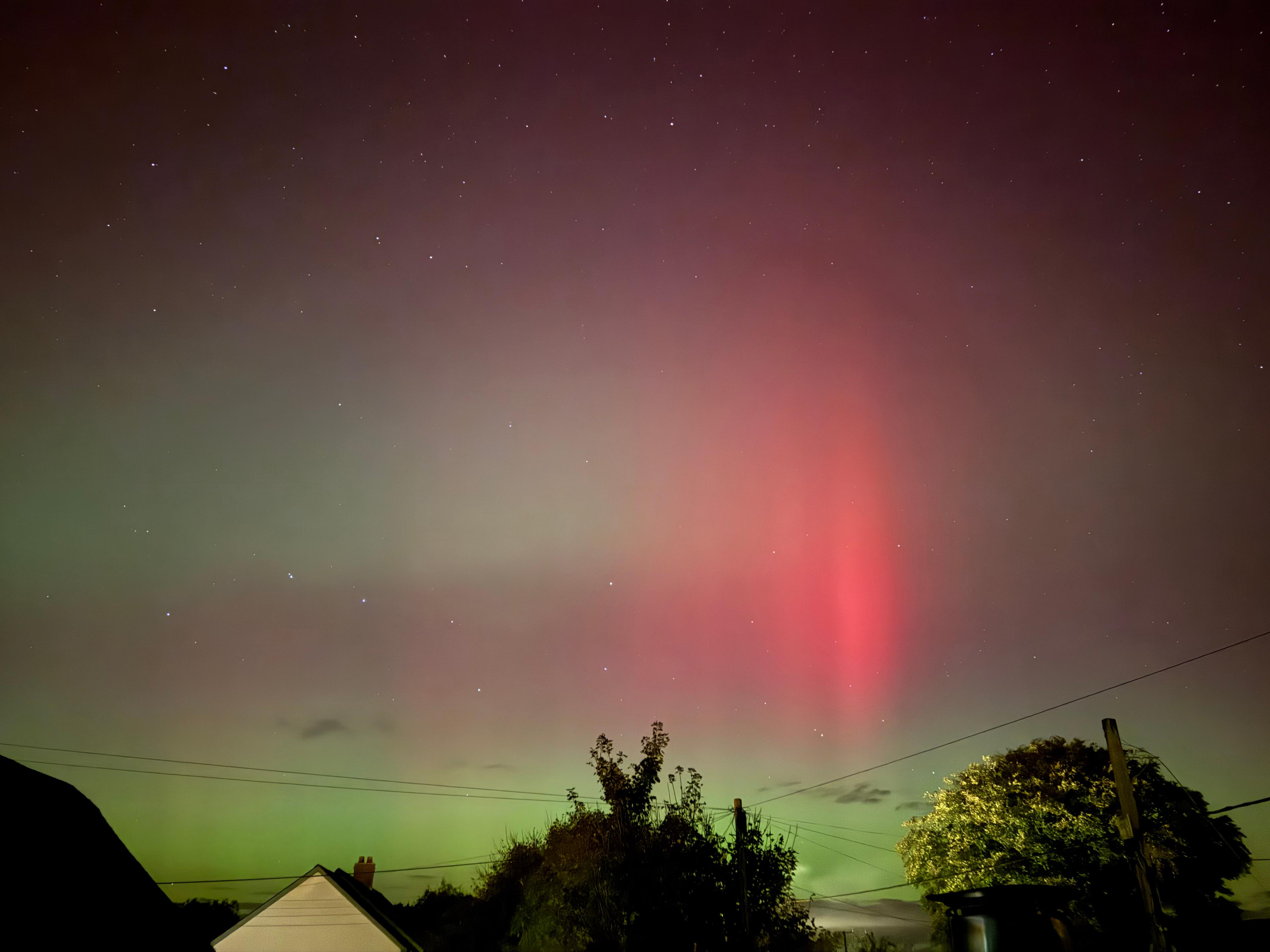 A single red pillar rising over Northlew, Devon, during the October 2024 aurora — a rare sight this far south.
