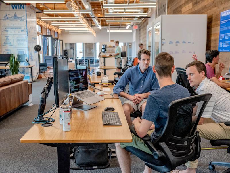 Small business owner collaborating with web design team