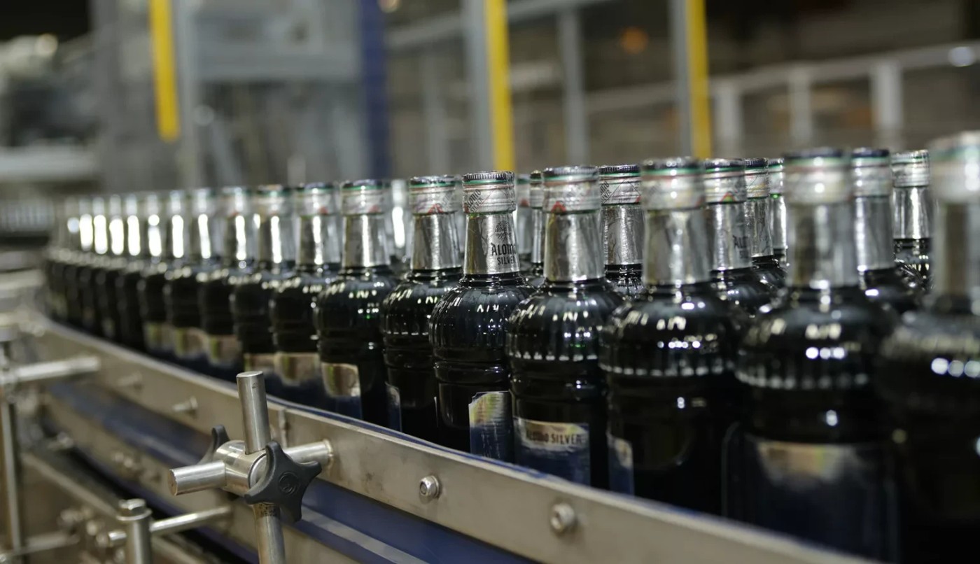 Alomo bottles moving along Kasapreko’s production line
