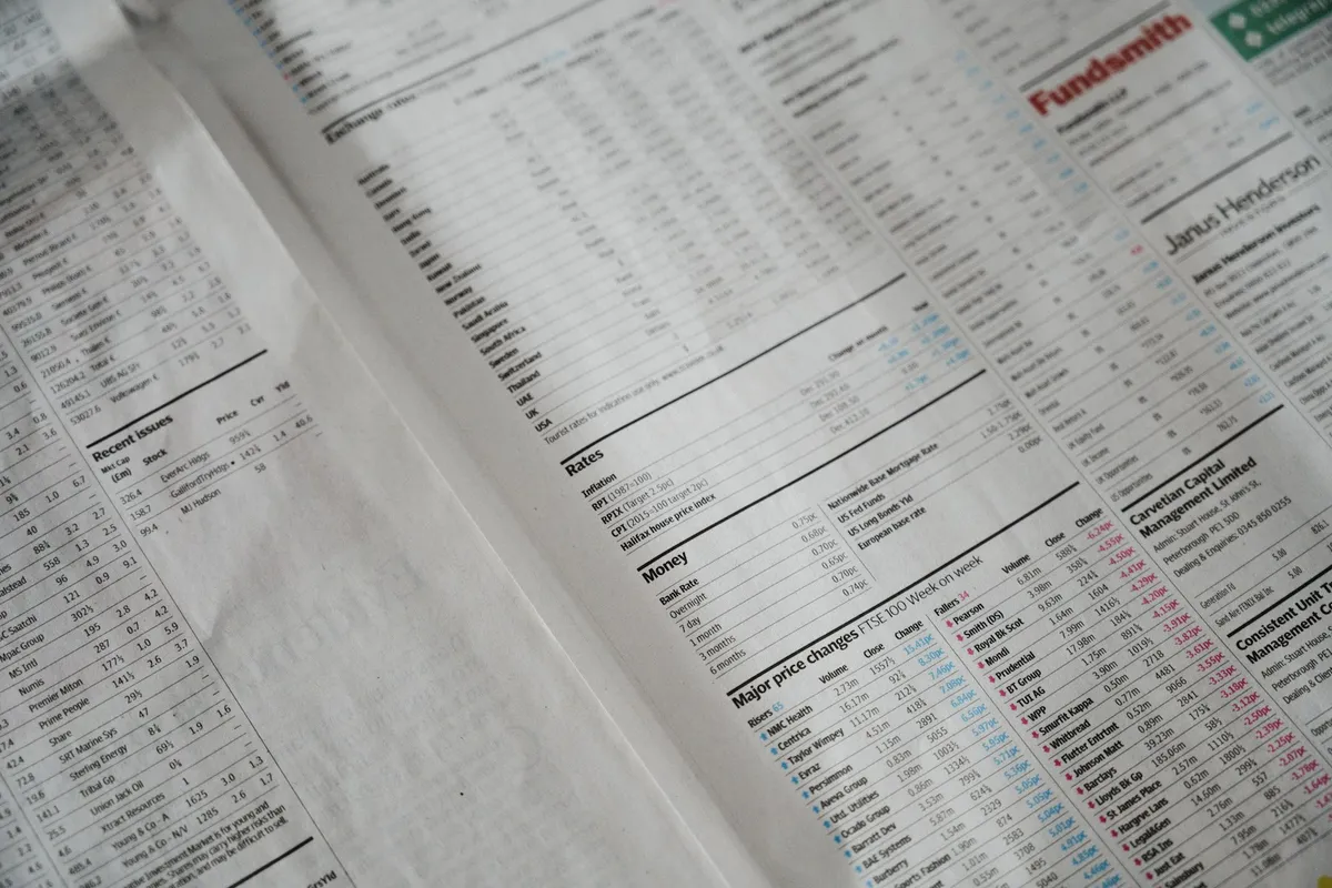 Close-up of financial newspaper showing columns of numbers — the real math behind B2B outbound