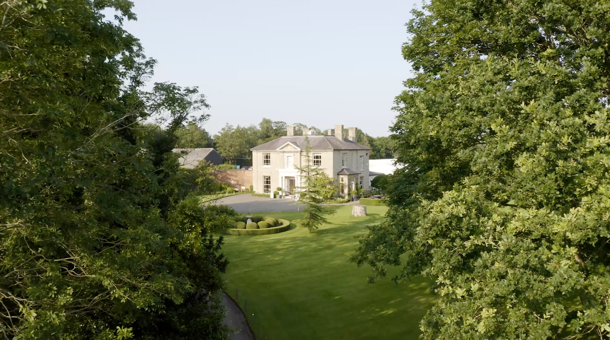 Country house wedding venue surrounded by lawns and trees, The Tabor Group