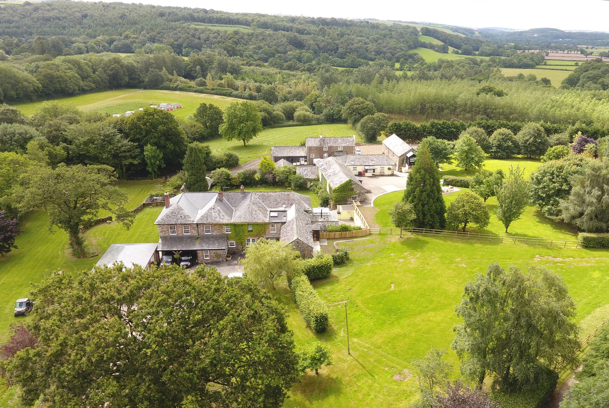 Aerial view of Wooladon Estate's stone farmhouse, outbuildings and surrounding fields
