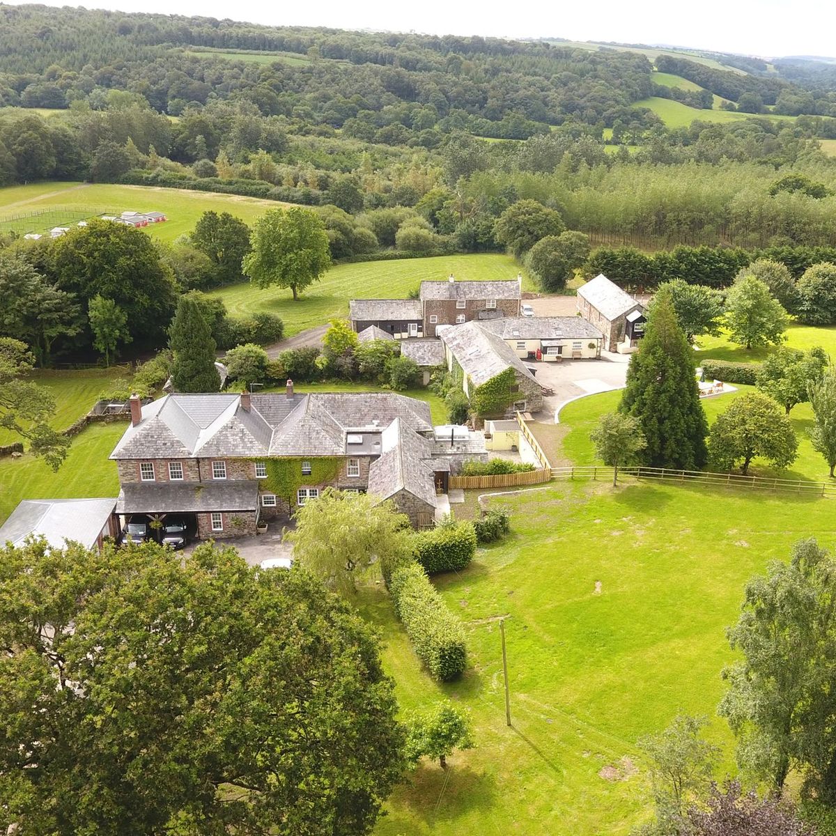 Aerial view of Wooladon Estate's stone farmhouse, outbuildings and surrounding fields
