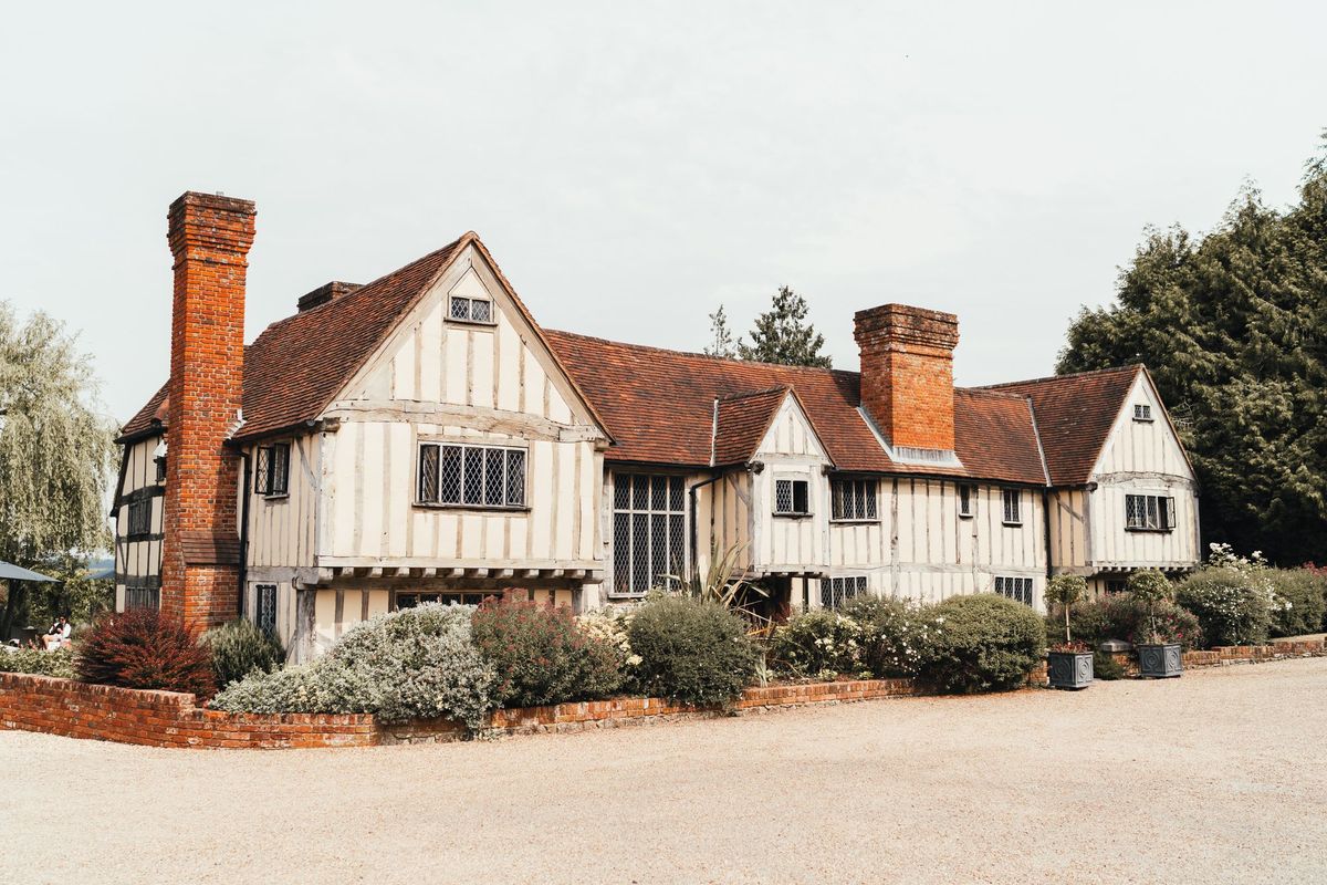 Tudor-style timber-framed manor house at Harper Weddings, surrounded by gardens