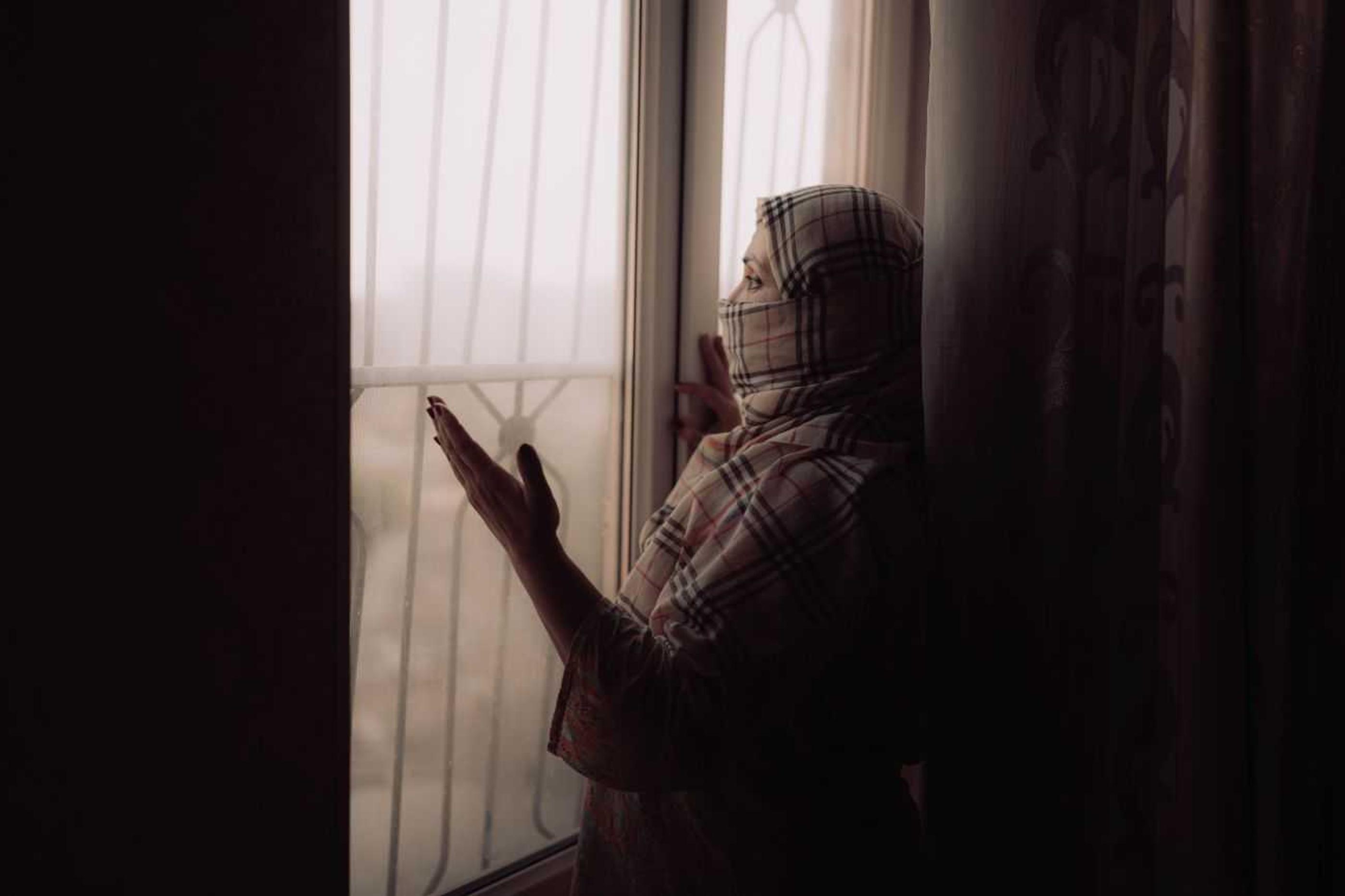 Zakie is standing at the window