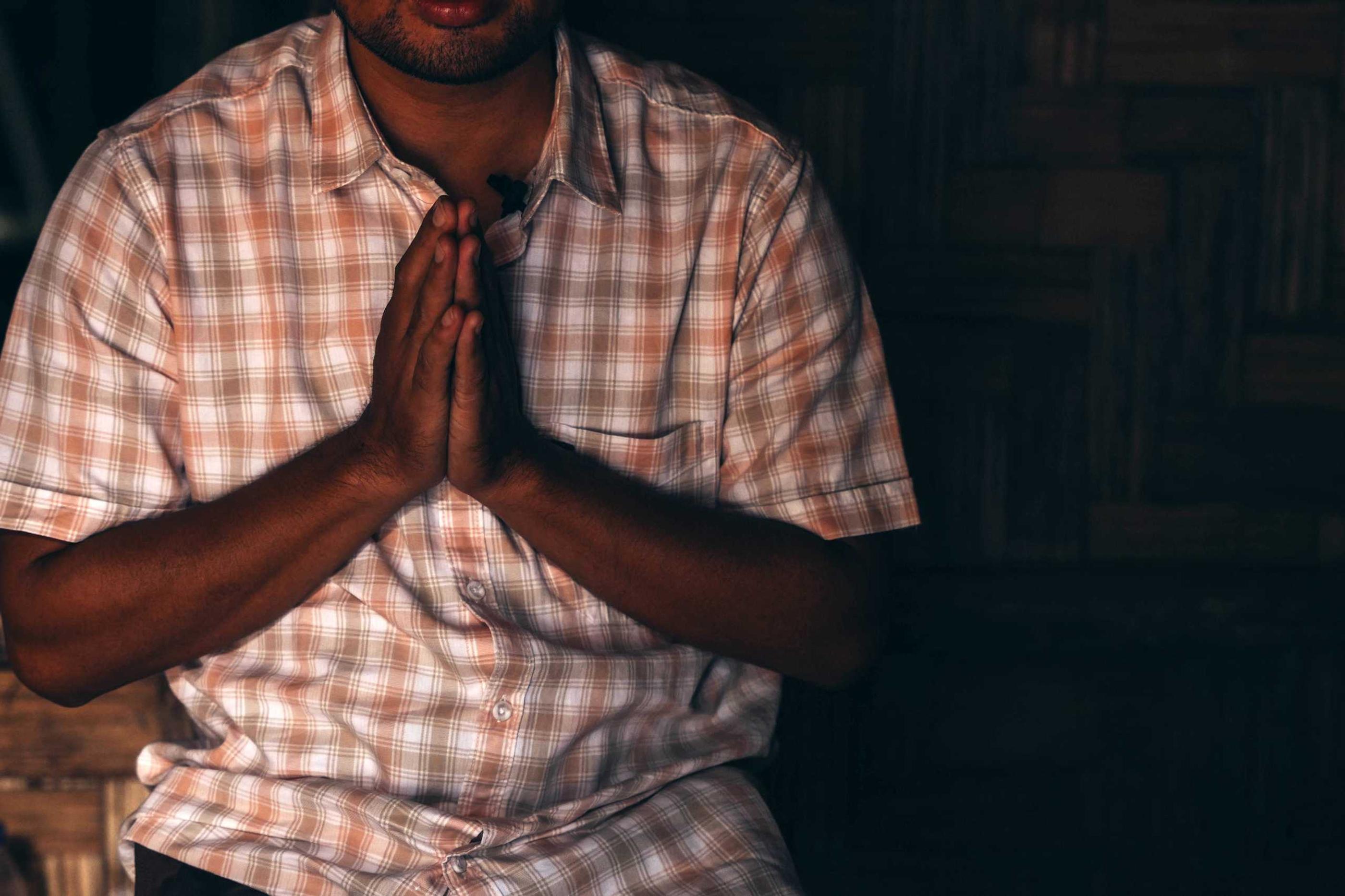 Pastor Sian praying
