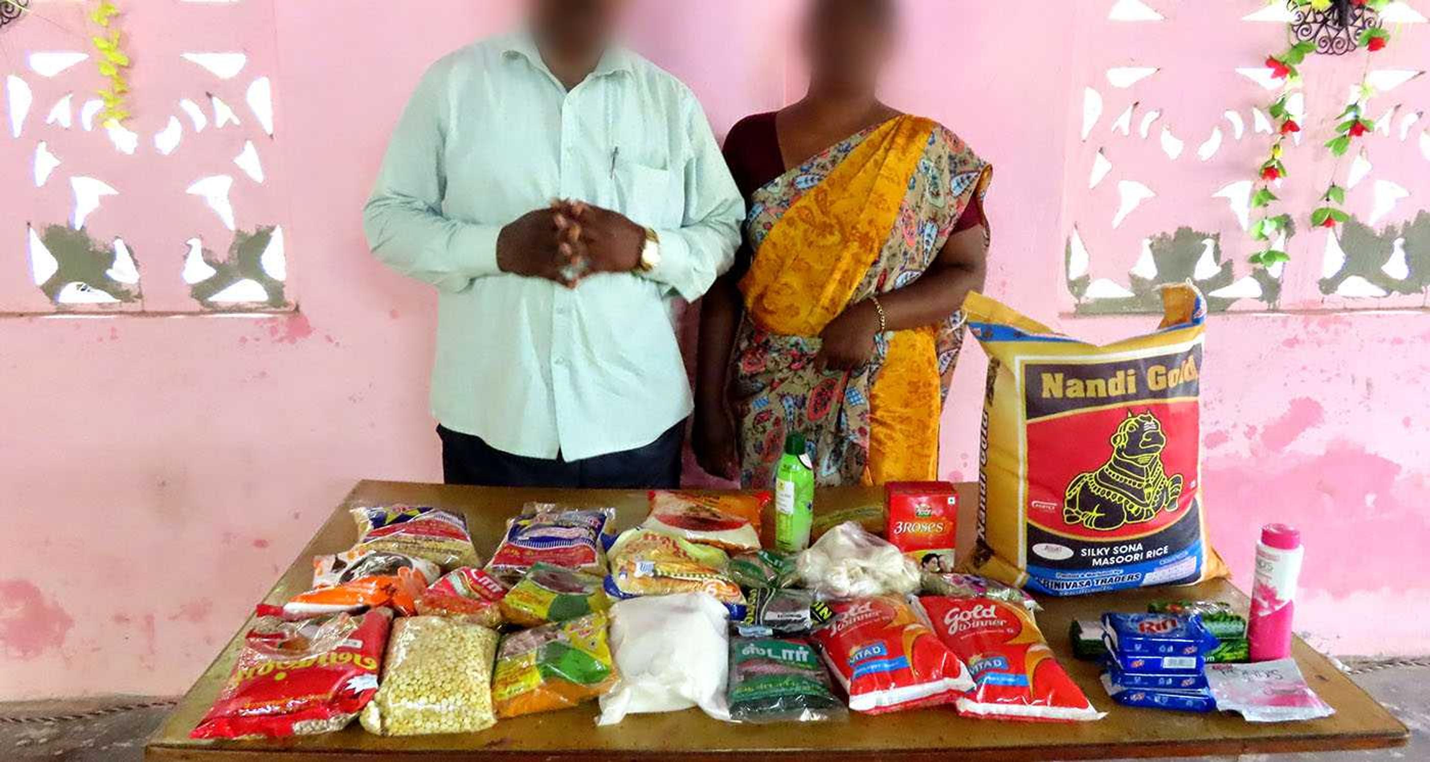 Two Indian Christians with food aid