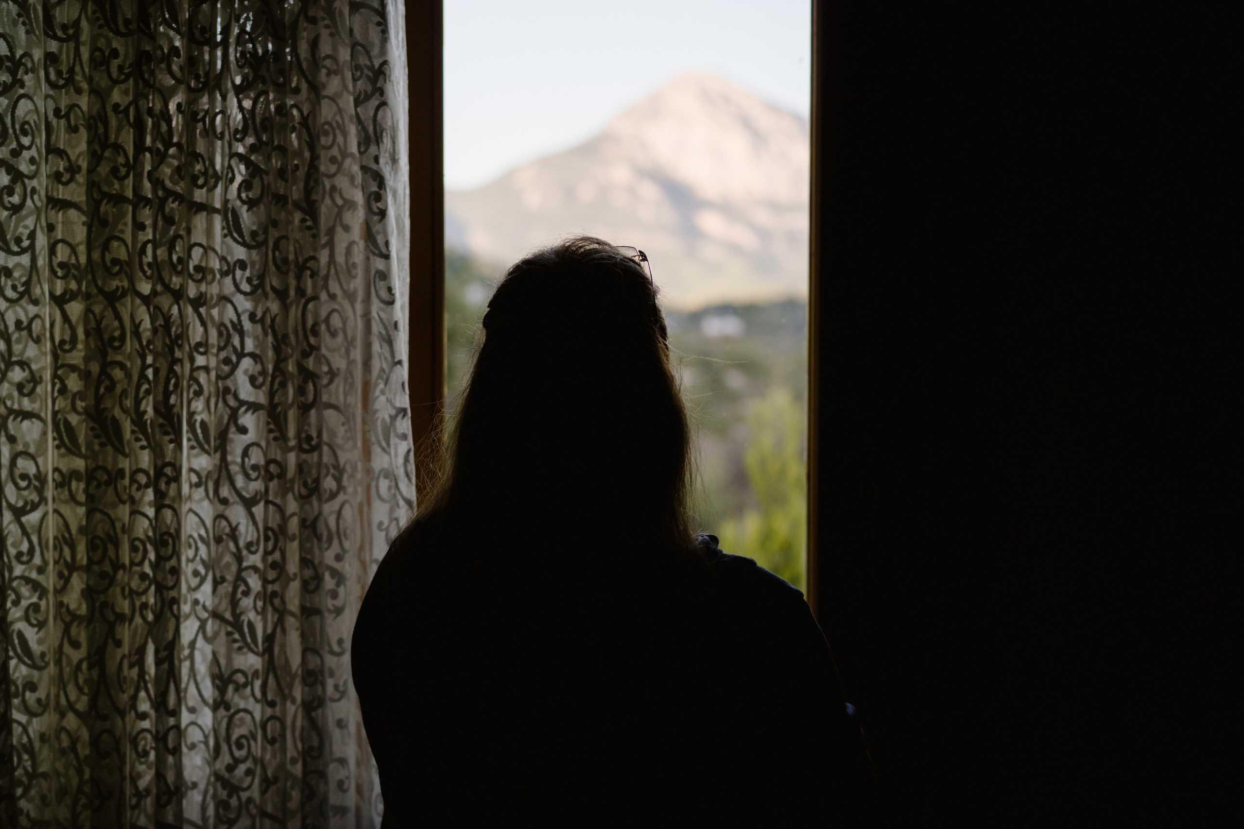 Somayeh looking out a window