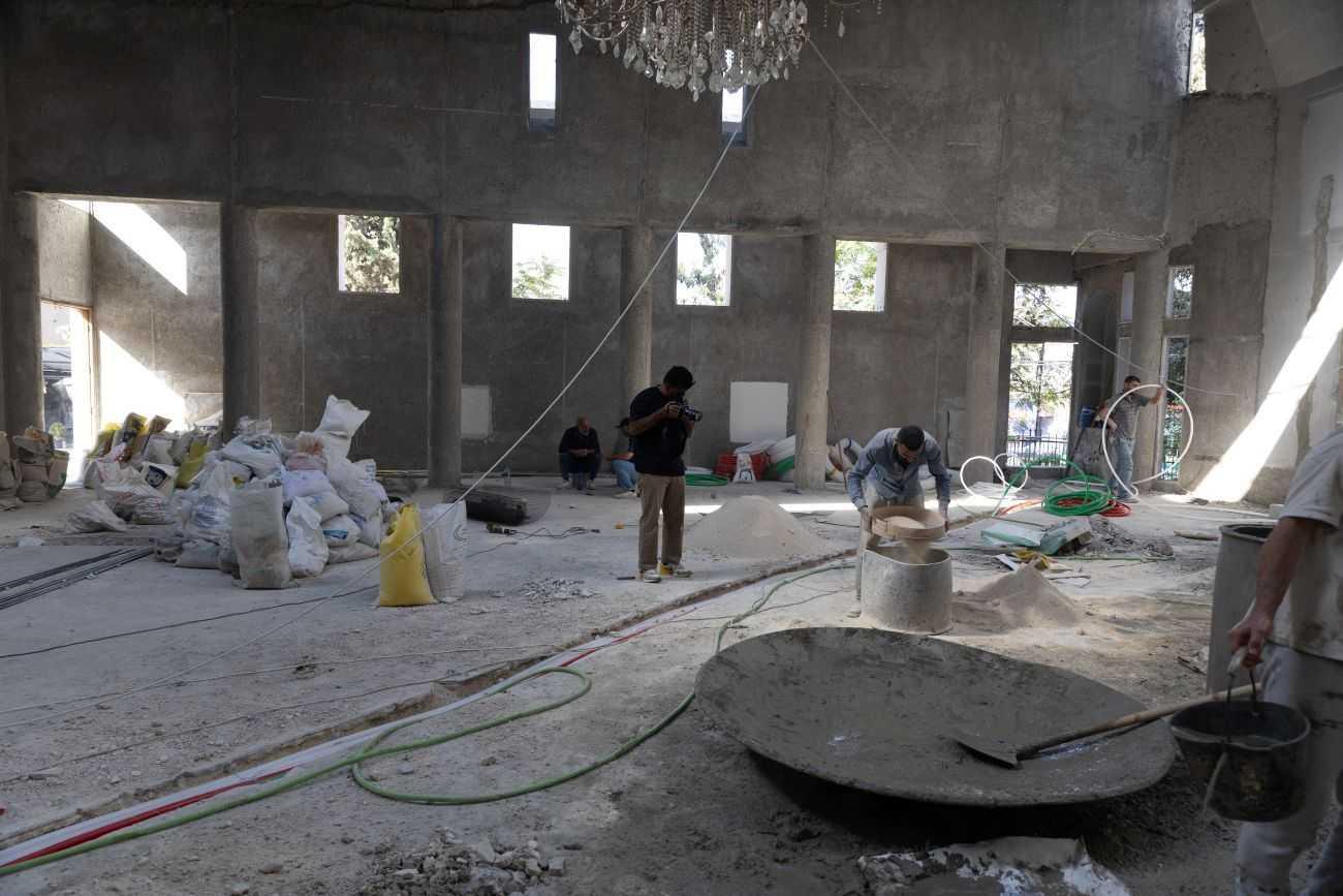 Men working in Saint Elias Church in Damascus in reconstruction after attack