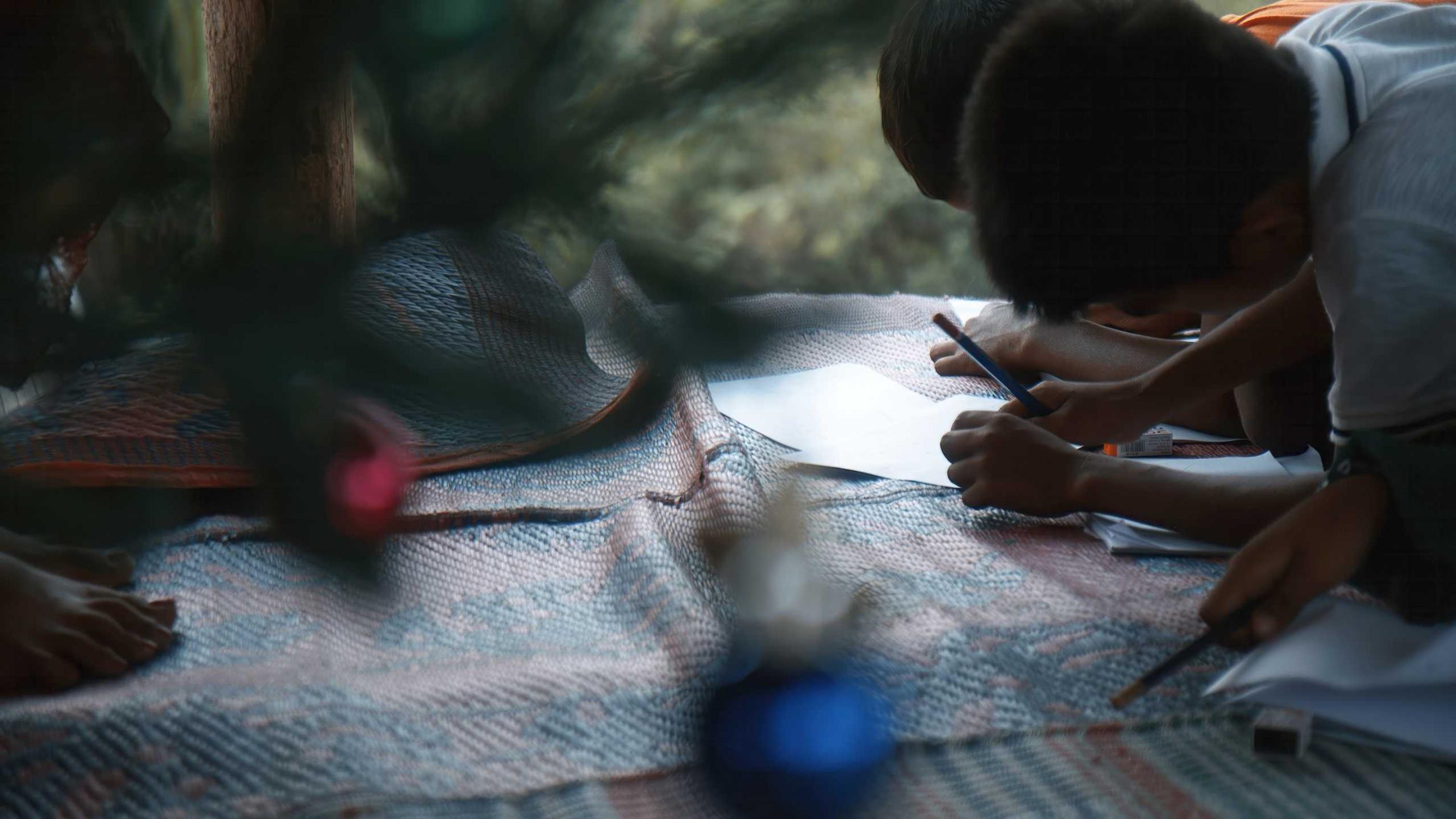 A Muslim-background believer girl writes a letter to God at a summer camp in China 