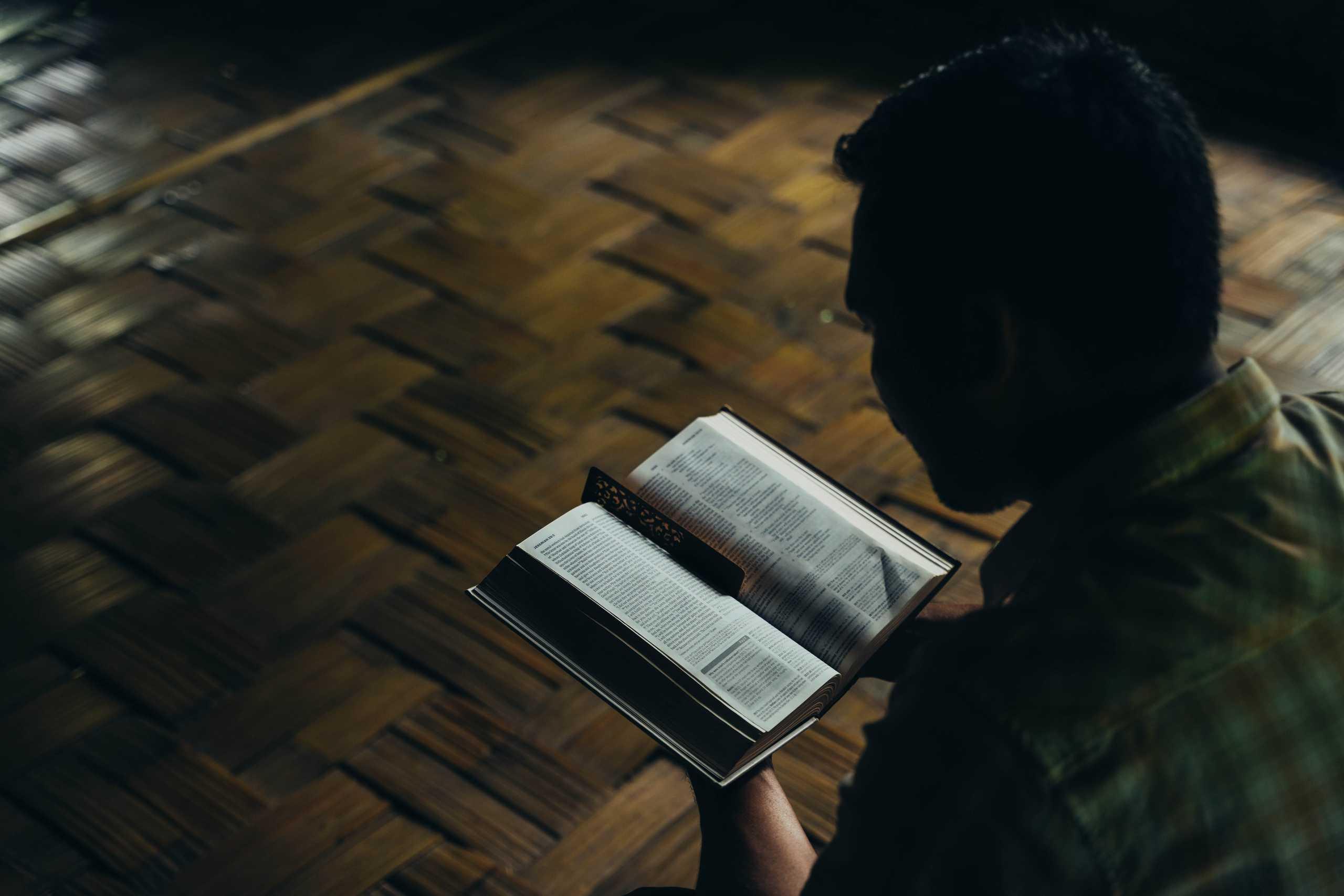 Sian reading his Bible