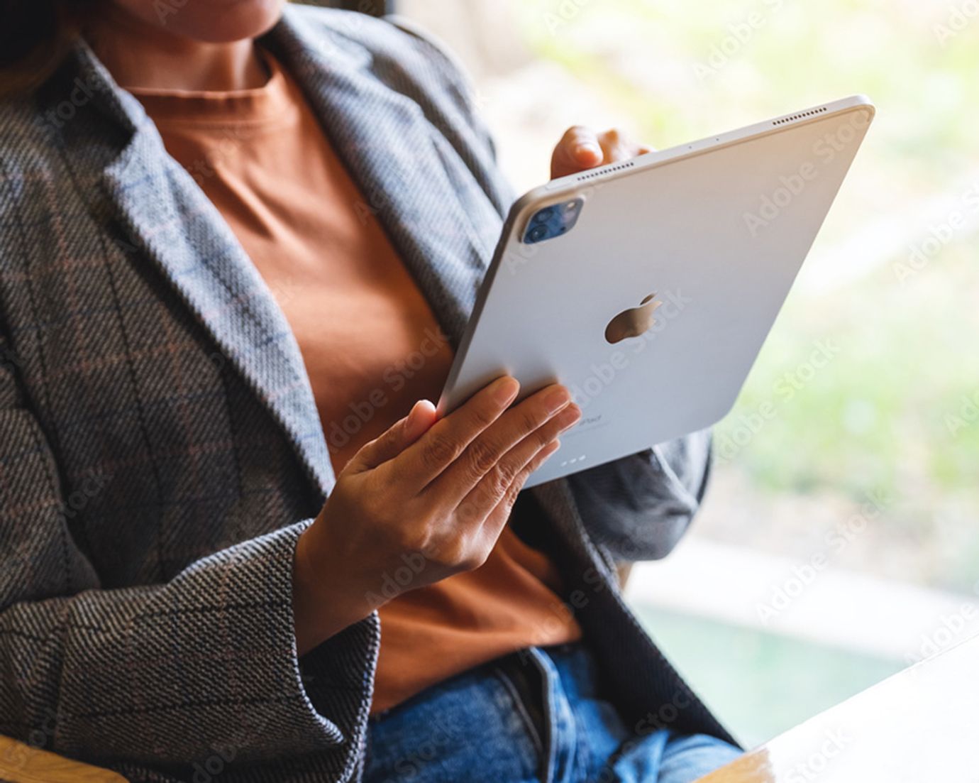 women looking at ipad