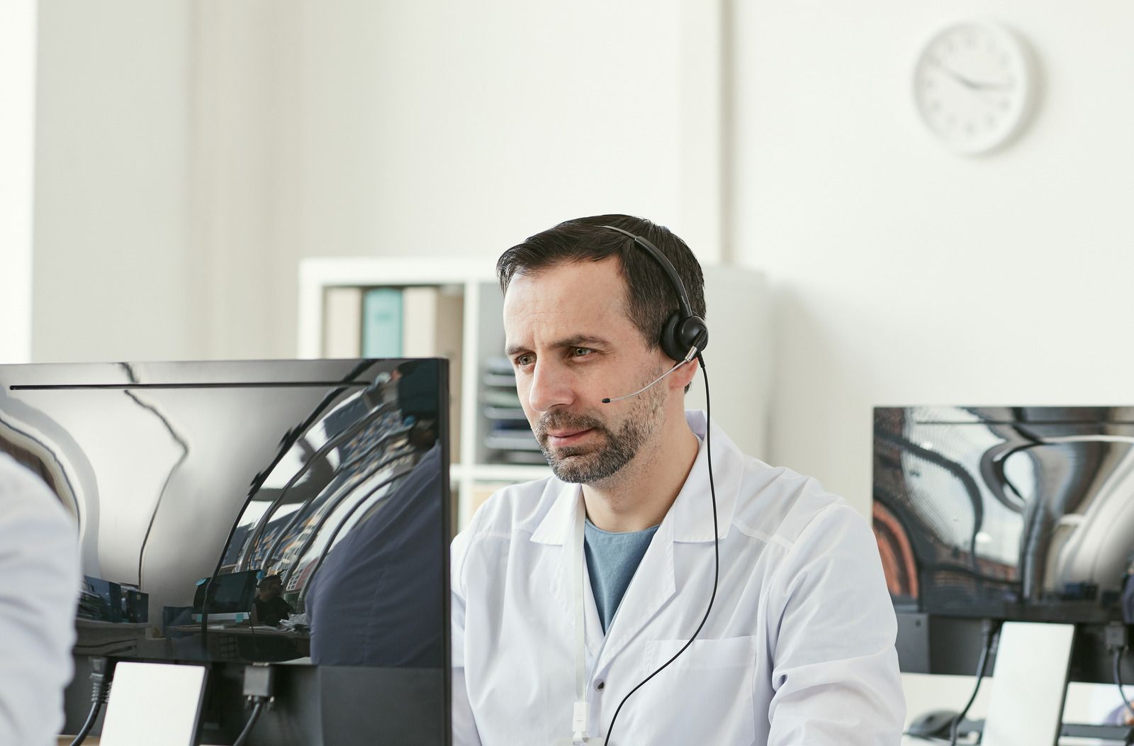 Male doctor working in front of computer