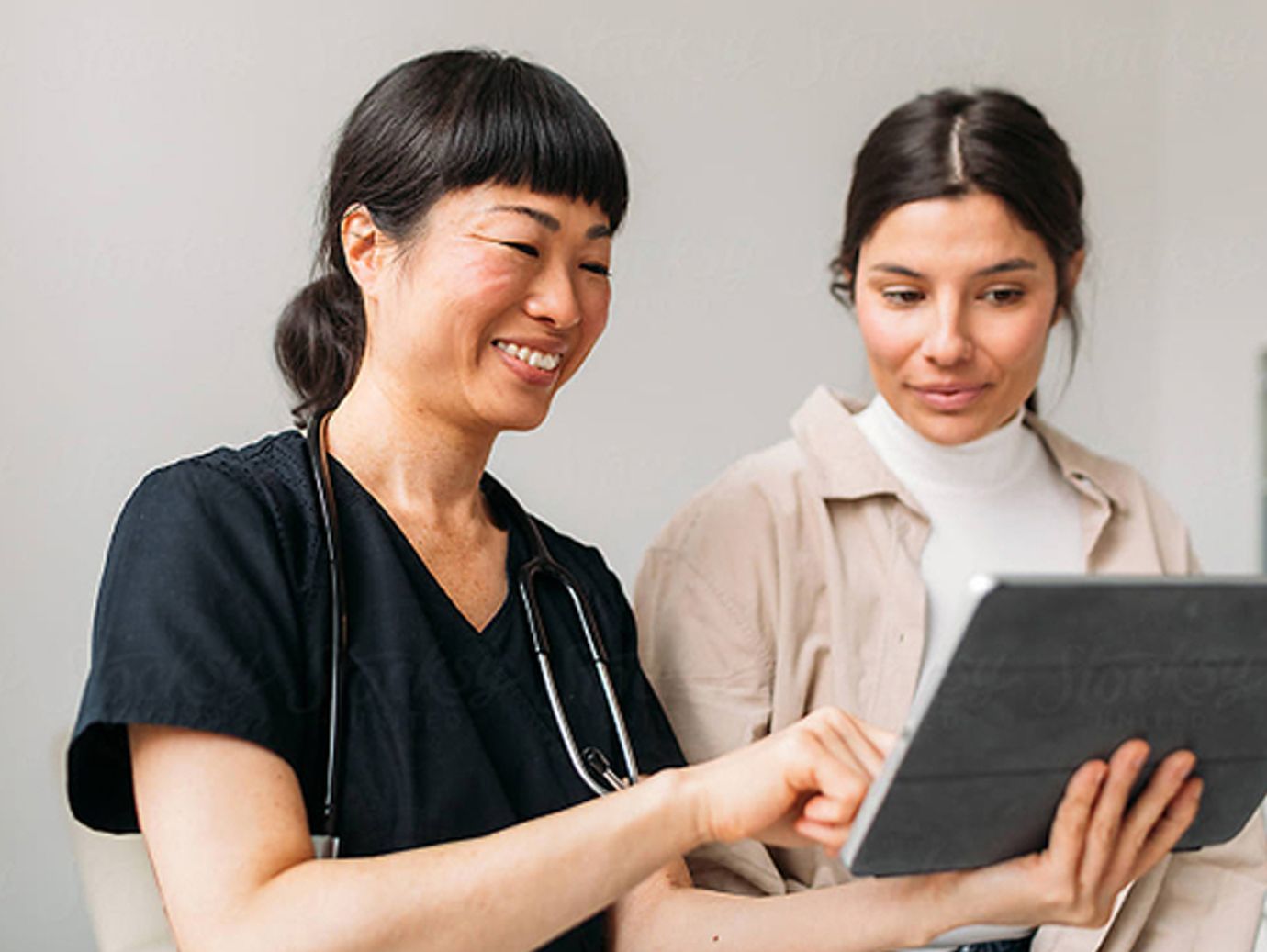 Female nurse and patient discussing results