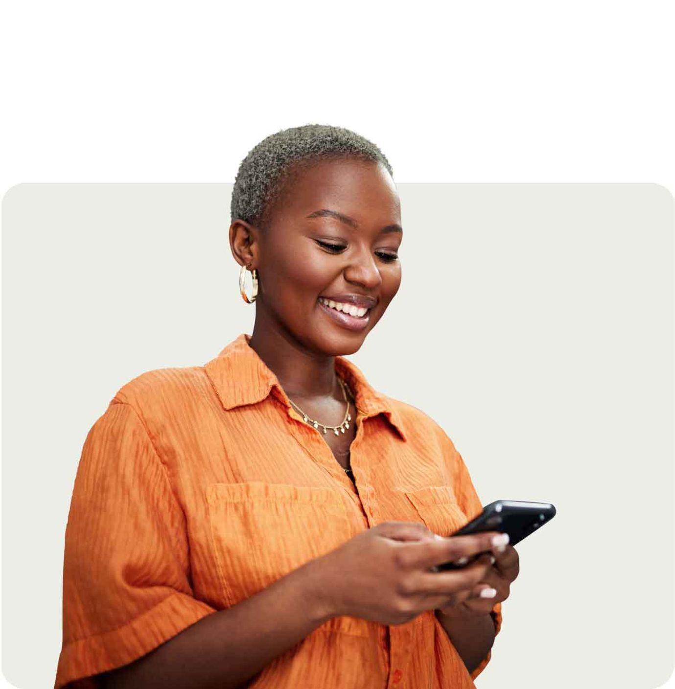 lady smiling looking at phone