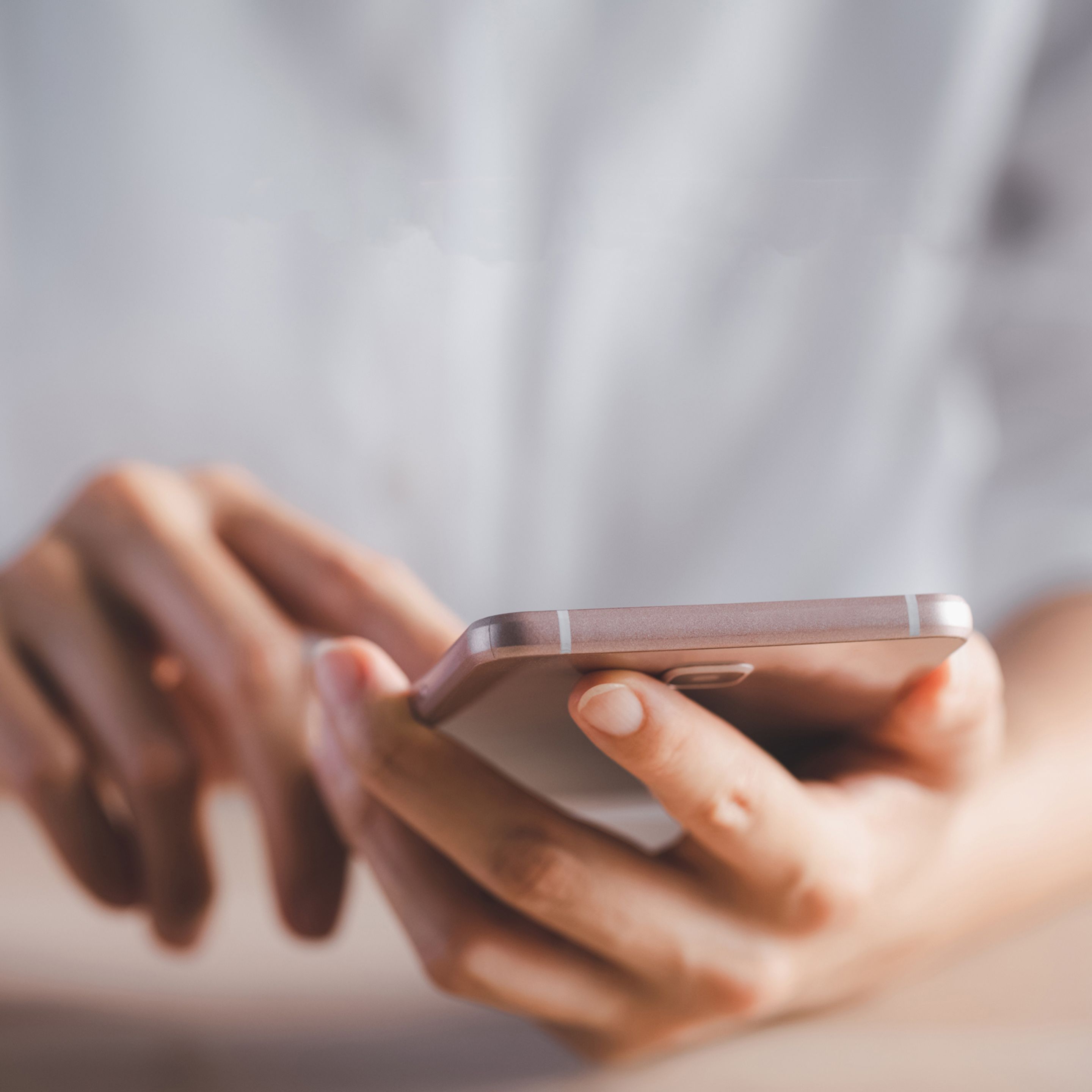 Hands using smartphone