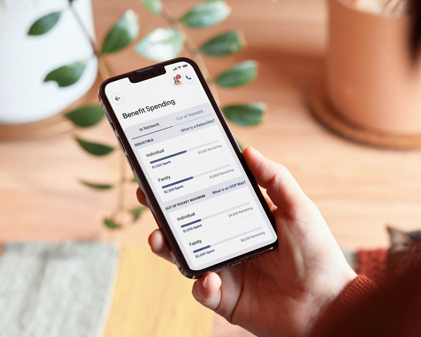 Hand using phone on Rightway care navigation and PBM app