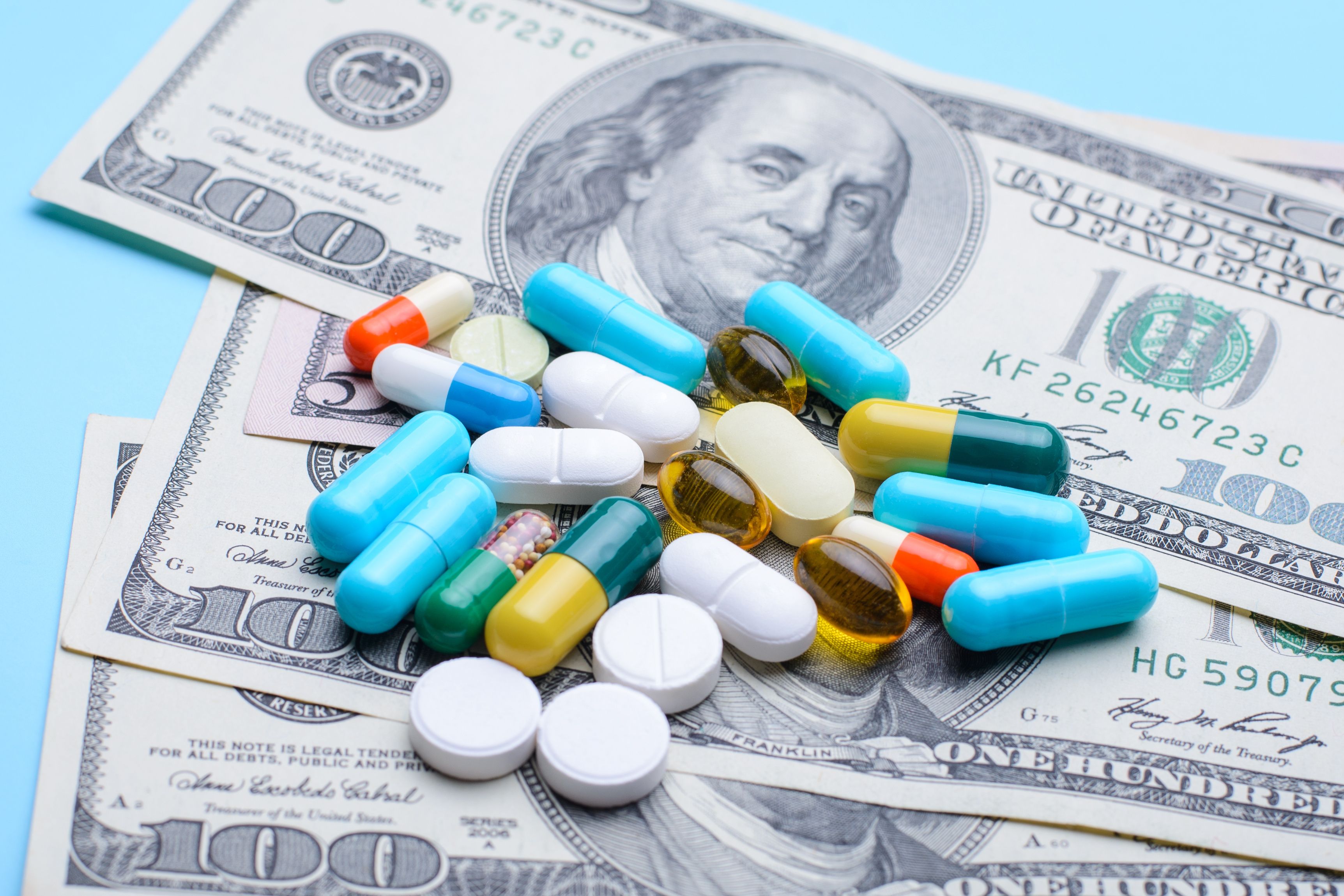 money with a variet pill on top